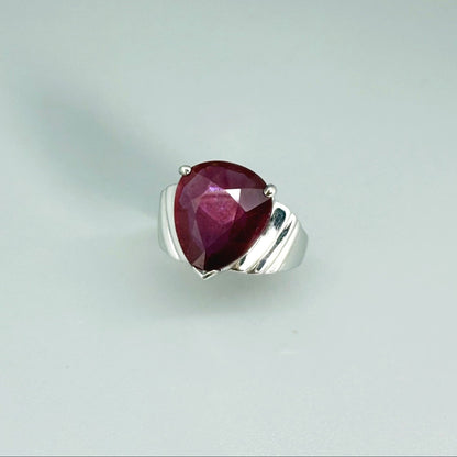 Ruby solitaire ring in white gold plated sterling silver, featuring a natural deep red gemstone, elegant and timeless design.
