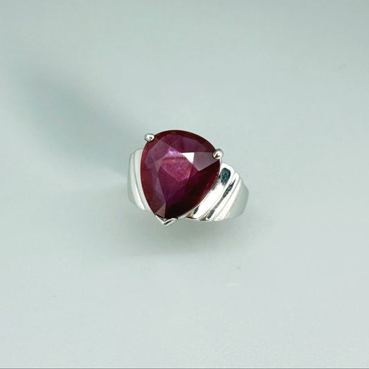 Ruby solitaire ring in white gold plated sterling silver, featuring a natural deep red gemstone, elegant and timeless design.