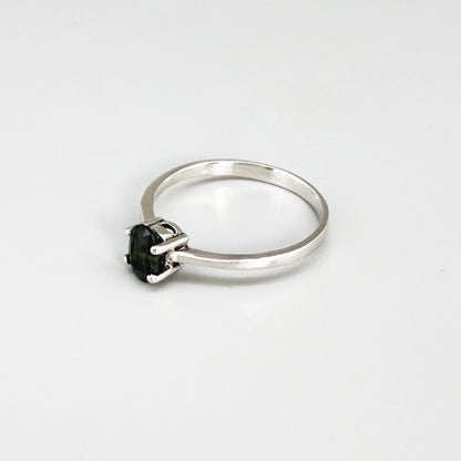 Sapphire solitaire ring in white gold plated sterling silver, featuring a natural deep blue gemstone, elegant and timeless design.