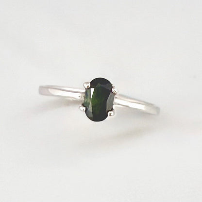 Sapphire solitaire ring in white gold plated sterling silver, featuring a natural deep blue gemstone, elegant and timeless design.