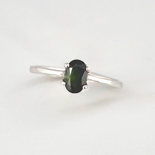Sapphire solitaire ring in white gold plated sterling silver, featuring a natural deep blue gemstone, elegant and timeless design.