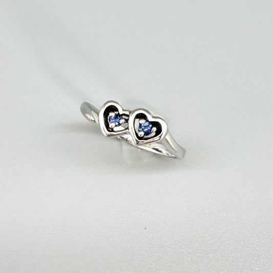 Delicate sapphire ring in white gold plated sterling silver, featuring natural blue gemstones in a graceful setting, elegant and timeless design.
