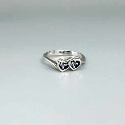 Delicate sapphire ring in white gold plated sterling silver, featuring natural blue gemstones in a graceful setting, elegant and timeless design.