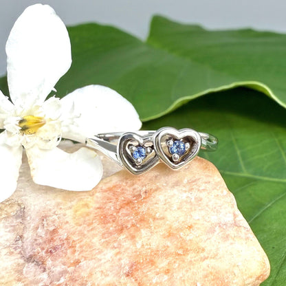 Delicate sapphire ring in white gold plated sterling silver, featuring natural blue gemstones in a graceful setting, elegant and timeless design.