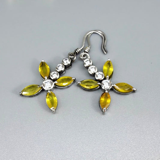Sterling silver drop earrings with yellow sapphires and cubic zirconia in a floral design, linked to the Sapphire Jewelry Collection.