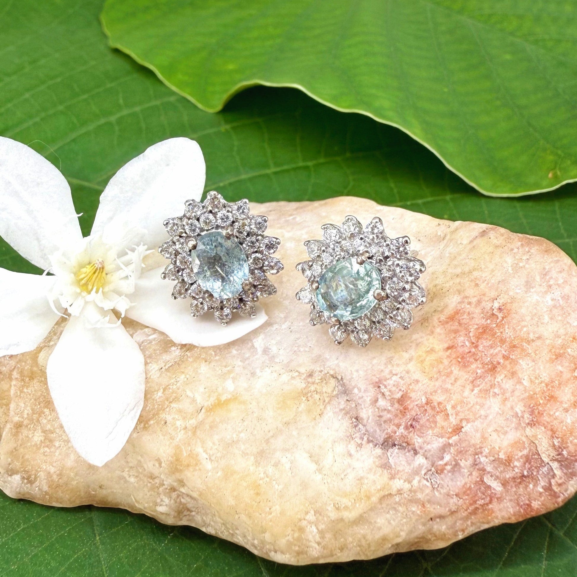 Aquamarine and cubic zirconia stud earrings in white gold plated sterling silver with butterfly backs.
