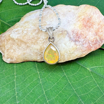 Handmade white gold plated silver pendant with 14.76 ct rose quartz and cubic zirconia accents, elegant and refined design.