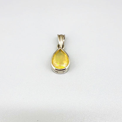 Handmade white gold plated silver pendant with 14.76 ct rose quartz and cubic zirconia accents, elegant and refined design.