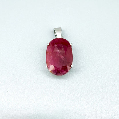 White gold plated silver pendant featuring a 17.12 ct natural ruby with deep red brilliance, handcrafted and elegant design.