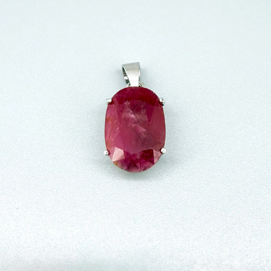 White gold plated silver pendant featuring a 17.12 ct natural ruby with deep red brilliance, handcrafted and elegant design.